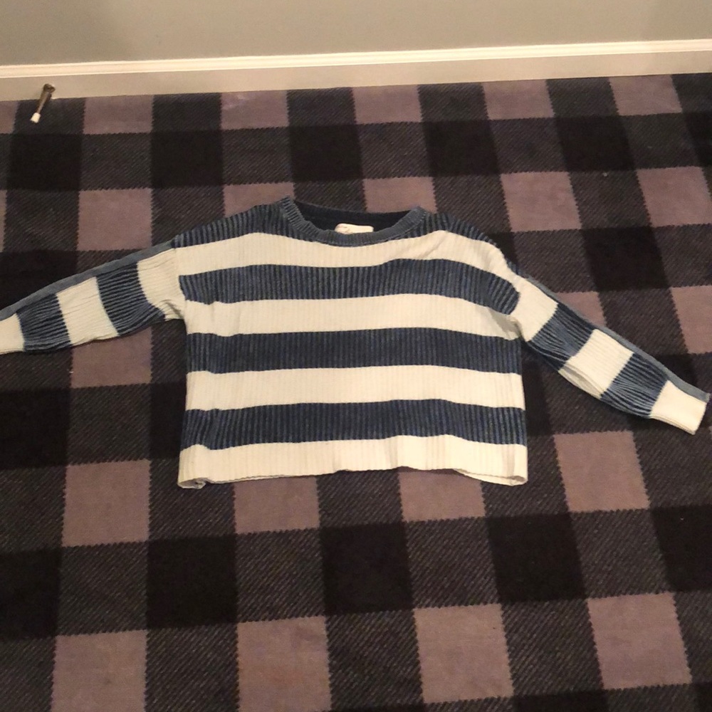 An oversized knitted dark blue and black sweater